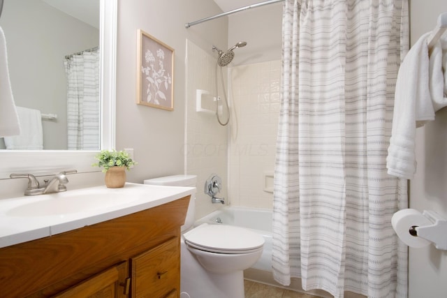 bathroom with vanity, shower / bath combo with shower curtain, and toilet