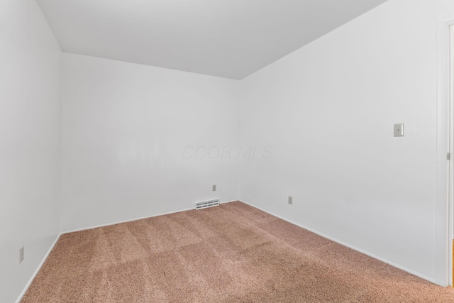 unfurnished room featuring carpet floors and visible vents