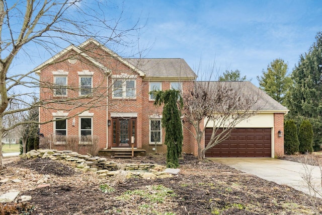 view of front of house featuring concrete driveway, brick siding, and an attached garage