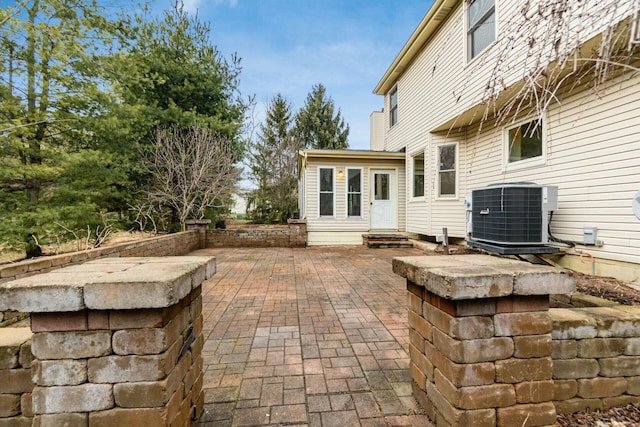 view of patio / terrace with entry steps and central AC