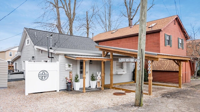 view of front of house with a shingled roof