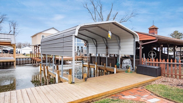 dock area with a water view and boat lift