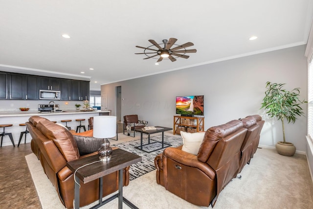 living room featuring ornamental molding, recessed lighting, ceiling fan, and baseboards