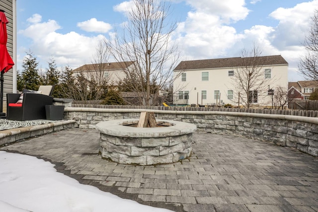 view of patio / terrace with an outdoor fire pit