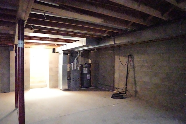 unfinished basement with water heater