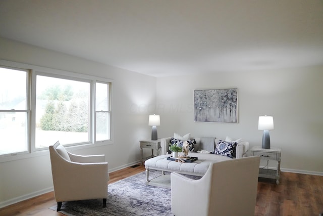 living room with dark wood-style floors and baseboards