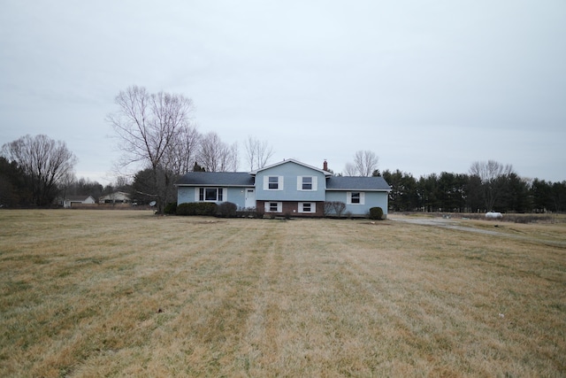 split level home with a front yard