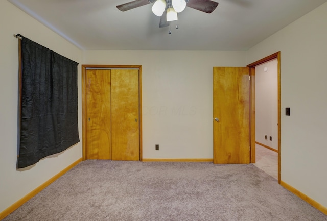 carpeted bedroom featuring ceiling fan, baseboards, and a closet