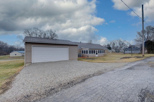 exterior space with gravel driveway