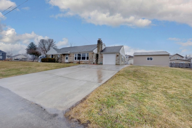 ranch-style house featuring a front yard, stone siding, an attached garage, and concrete driveway