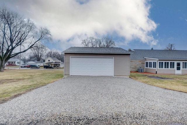 detached garage featuring central air condition unit