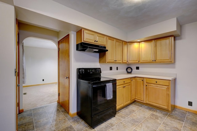 kitchen with arched walkways, baseboards, light countertops, under cabinet range hood, and black range with electric cooktop