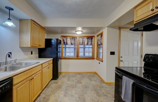 kitchen with baseboards, under cabinet range hood, light countertops, black appliances, and a sink