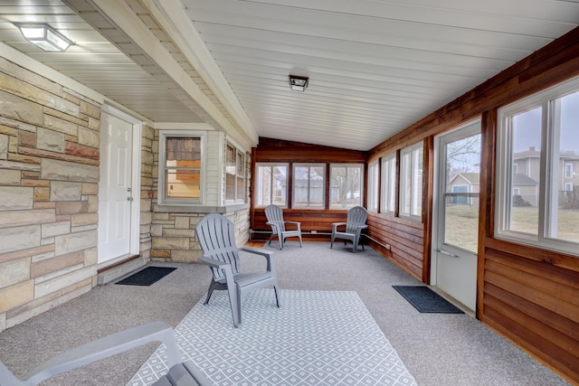 sunroom / solarium featuring lofted ceiling