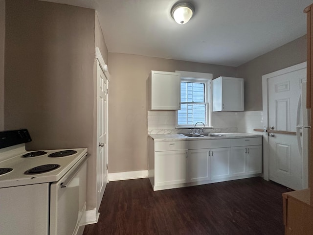 kitchen with light countertops, white range with electric cooktop, a sink, and white cabinets