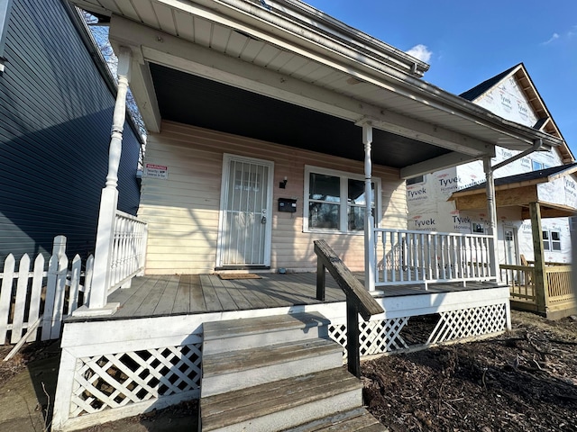 doorway to property with a porch