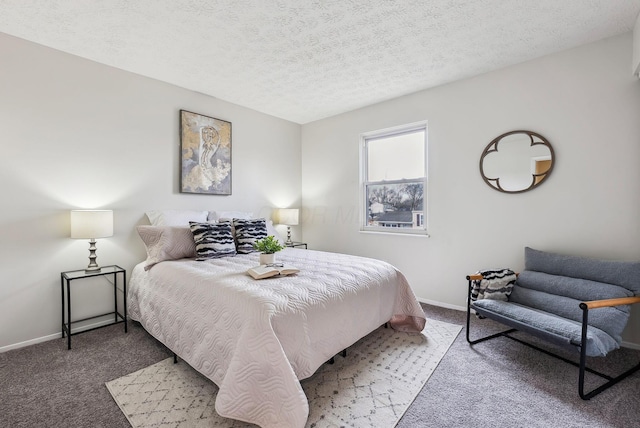 bedroom with a textured ceiling, baseboards, and carpet flooring