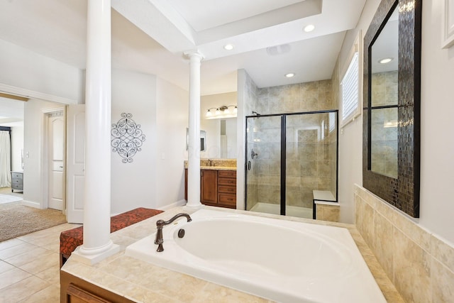 full bath with a shower stall, vanity, tile patterned flooring, ornate columns, and a bath