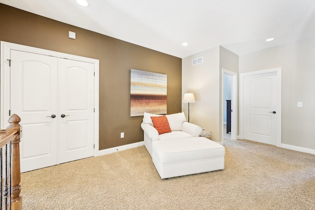 living area with recessed lighting, carpet flooring, visible vents, and baseboards