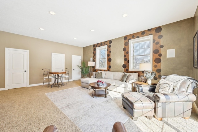 living area with light carpet, baseboards, and recessed lighting