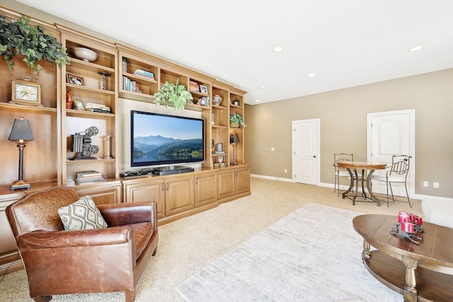 living area with light carpet, recessed lighting, and baseboards