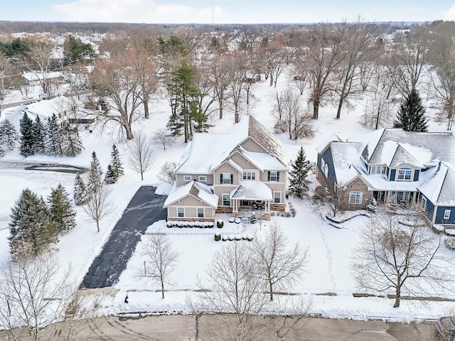 snowy aerial view featuring a residential view