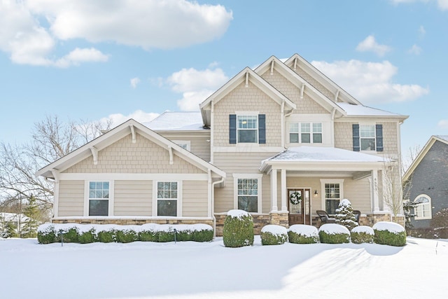 craftsman inspired home with stone siding and covered porch