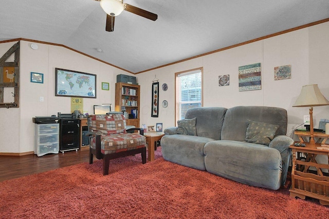 living room with a textured ceiling, wood finished floors, a ceiling fan, vaulted ceiling, and crown molding