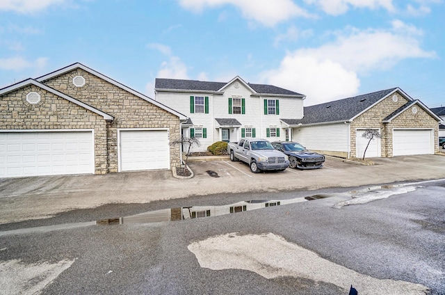 view of front of home featuring a garage and a residential view