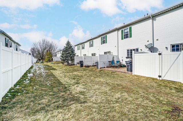 view of yard with a residential view and fence