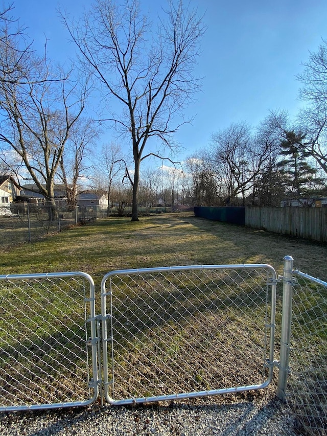 view of gate with fence