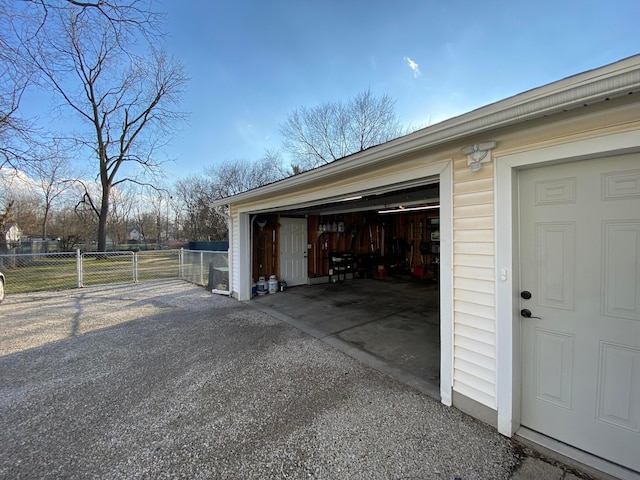 garage featuring a gate and fence