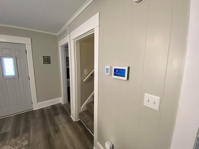 entryway featuring visible vents, baseboards, stairs, ornamental molding, and dark wood-style floors