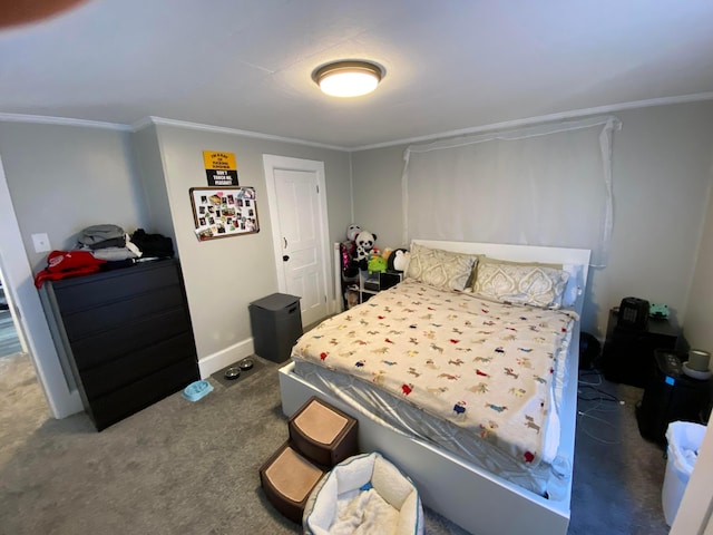 carpeted bedroom featuring crown molding and baseboards