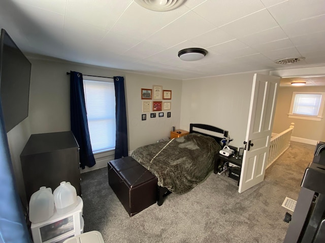 bedroom featuring carpet and visible vents