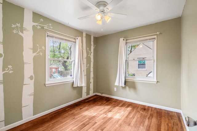 3093 Hamilton Ave, Columbus, OH 43224 - unfurnished room featuring a ceiling fan, baseboards, and light wood-style flooring