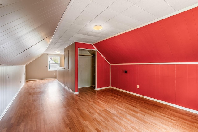 3093 Hamilton Ave, Columbus, OH 43224 - bonus room featuring baseboards, wood finished floors, and vaulted ceiling