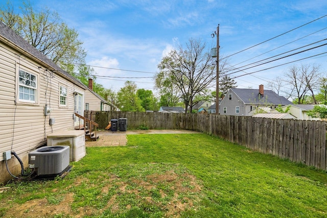 3093 Hamilton Ave, Columbus, OH 43224 - view of yard featuring a fenced backyard and central air condition unit