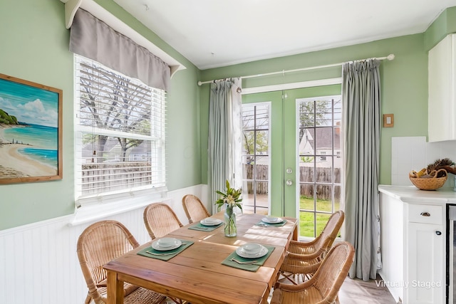 3093 Hamilton Ave, Columbus, OH 43224 - dining space featuring french doors and a wainscoted wall