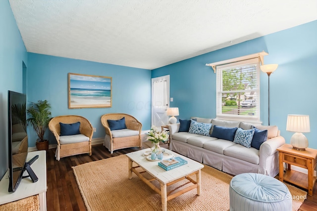 3093 Hamilton Ave, Columbus, OH 43224 - living area with baseboards, a textured ceiling, and dark wood finished floors