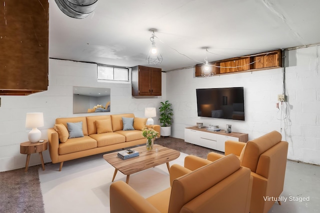 3093 Hamilton Ave, Columbus, OH 43224 - living room featuring concrete block wall and concrete floors