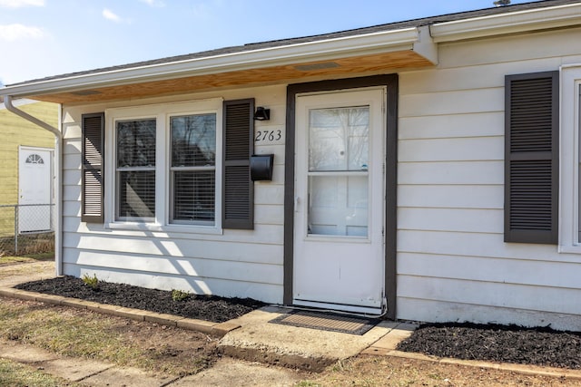 doorway to property with fence