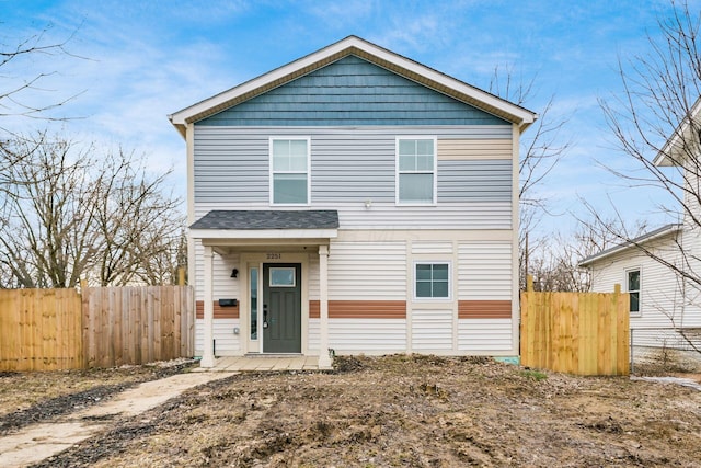 view of front of property featuring fence