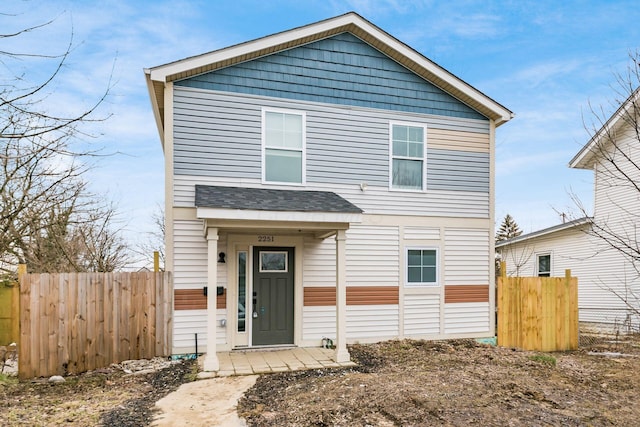 view of front of house with fence