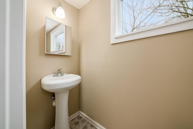 bathroom with baseboards