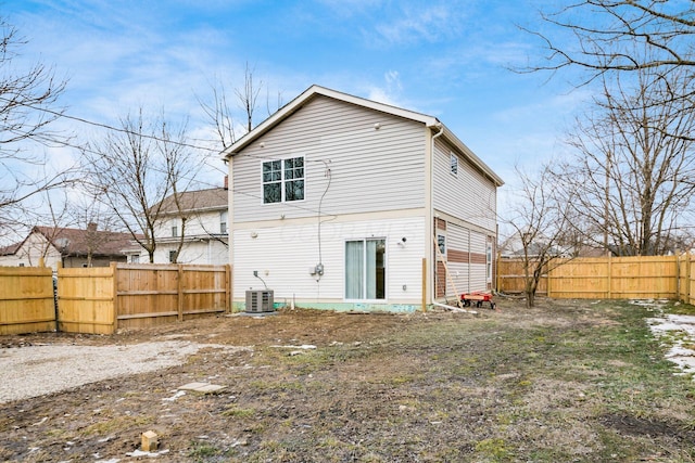 back of house featuring cooling unit and a fenced backyard