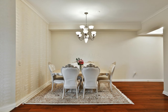 dining space featuring wood finished floors, baseboards, and an inviting chandelier