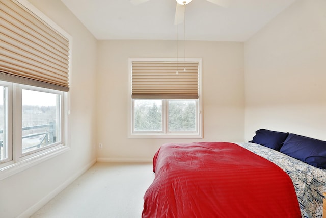 bedroom with carpet flooring, ceiling fan, and baseboards