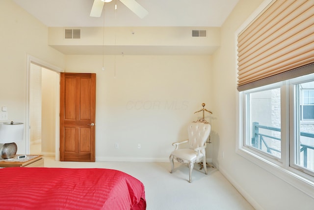 carpeted bedroom with visible vents and baseboards