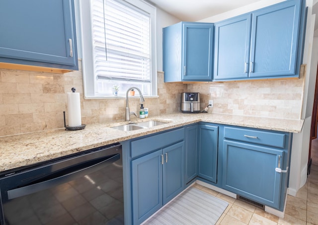 kitchen featuring black dishwasher, decorative backsplash, a sink, light stone countertops, and blue cabinets